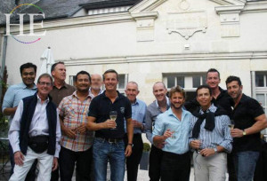 a big group of men at a wine tasting on the HE Travel gay bike tour in France