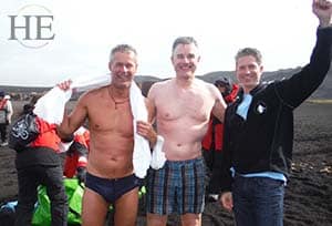 gentlemen with big smiles after plunging into frigid waters in antarctica