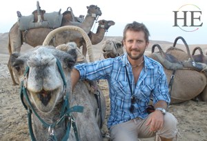 zachary moses with a smiling camel on the HE Travel gay israel Adventure tour