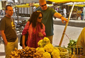 choosing veggies at a local market on the HE Travel gay India Adventure tour