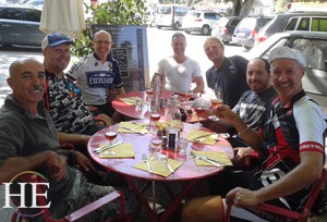 our group at a casual cafe on the HE Travel gay biking adventure in France