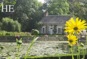small cottage with yellow flowers on the HE Travel gay bike tour in Loire Valley France