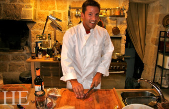 A private chef prepares a meal on HE Travel's Puglia Villa Culinary Experience.