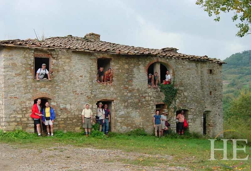 group of guys in an abandoned villa on the HE Travel gay hiking tour in Tuscany Italy