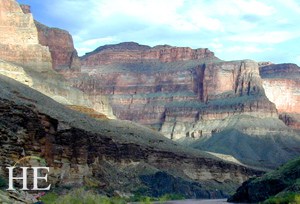 green and red cliffs with a blue sky on the HE Travel gay adventure Grand Canyon