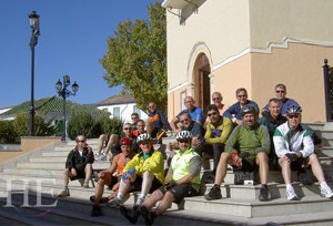 cyclists resting on the stairs on the HE Travel gay bike tour in Spain