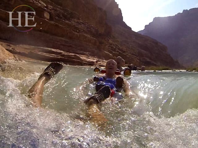 swimming in the little colorado river Grand Canyon with HE Travel gay group