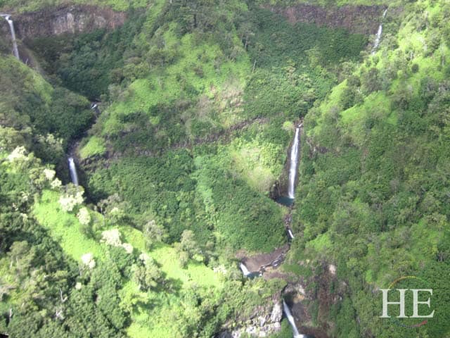 view from helicopter of waterfalls kauai hawaii with HE Travel