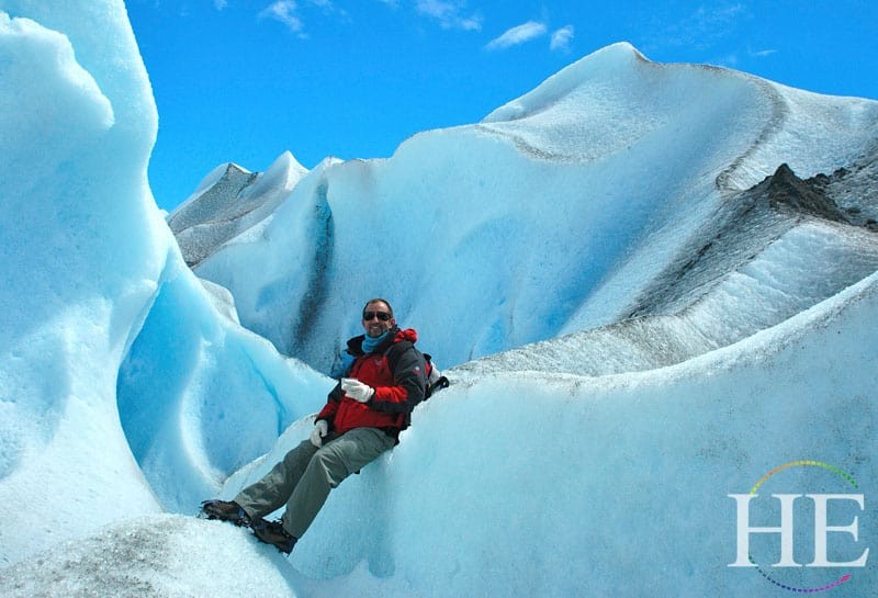 hiker on the glacier in Argentina with HE Travel gay tour