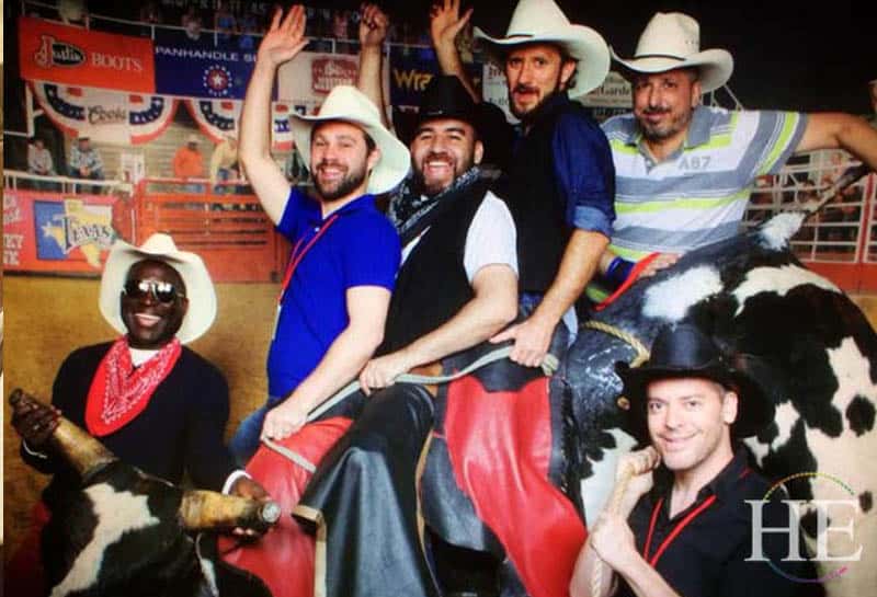 five gay guys climb atop an artificial Bull at Billy Bobs Honky Tonk in Ft. Worth Texas