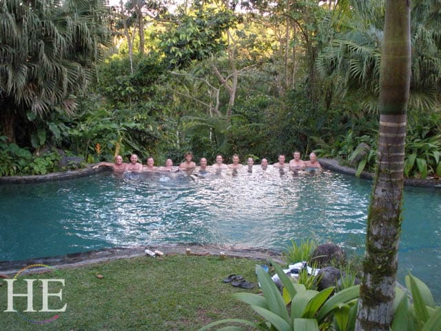 guys in an infinity pool at sarapiqui on the HE Travel gay adventure in Costa Rica