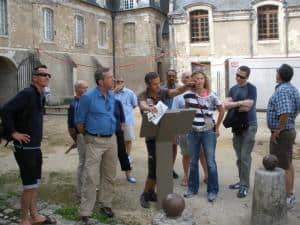 the group takes a walking tour on the HE Travel gay France bike tour