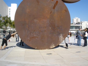 Zachary Moses tried to squash a woman with a sculpture in tel aviv