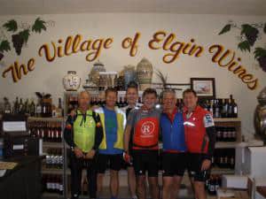 cyclists visit a winery on the HE Travel gay Arizona bike tour