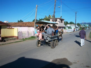 family in a horse-drawn cart in trinidad cuba