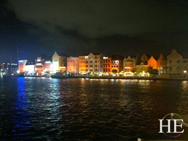 nighttime view of downtown willamsted curacao. gay travel tour