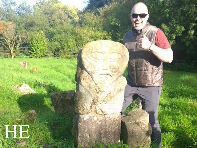 Chez stands next to an ancient burial marker in Ireland