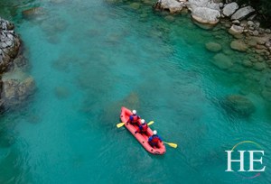 rafting the clear waters of the Socha River on the HE Travel gay bike tour in Slovenia