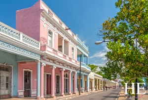 pink and blue buildings in Cienfuegos on the gay Cuba trip with HE Travel