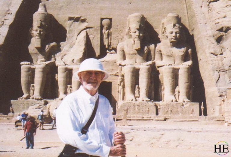 Gay traveler Hanns Ebensten stands in Egypt at Abu Simbel while on tour