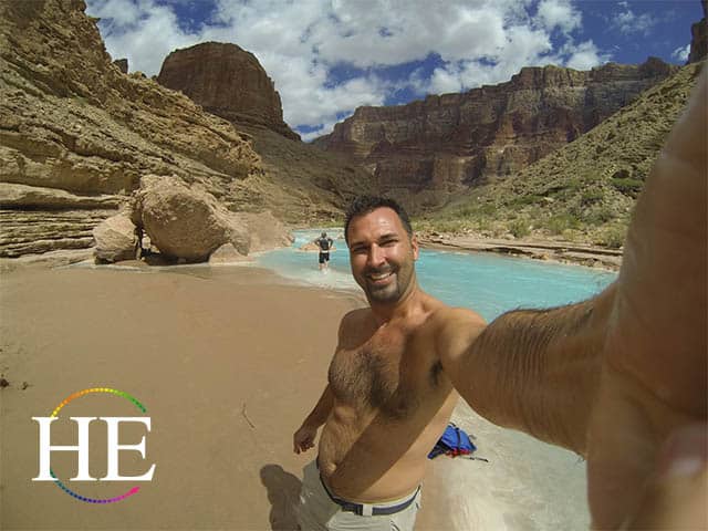 kaleb at the blue little colorado river on the HE Travel gay adventure Grand Canyon