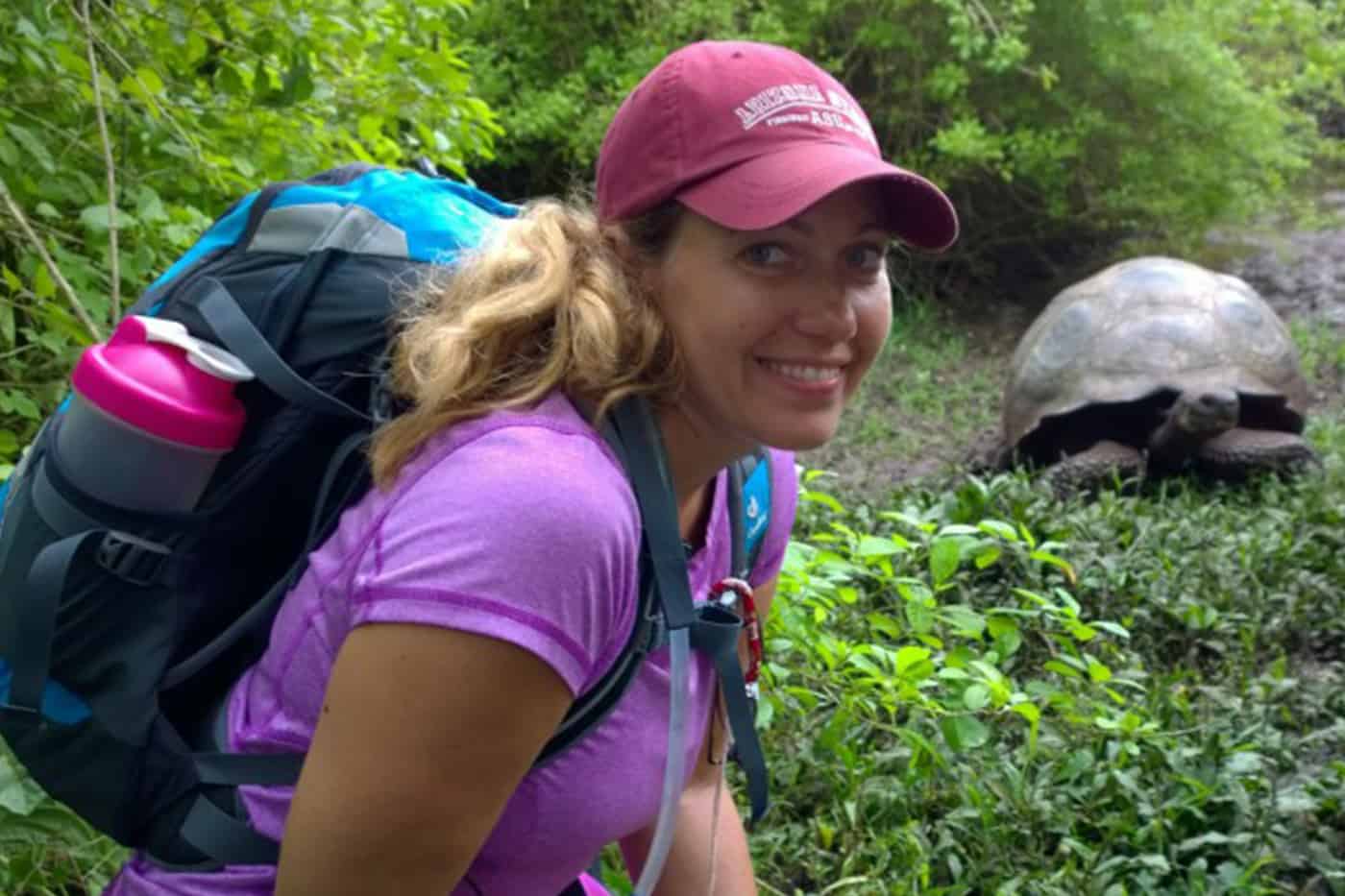 Trisha Ashcraft in Ecuador with a tortoise