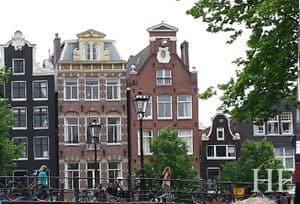 picturesque canal houses in Amsterdam on the HE Travel gay history tour. 