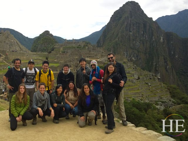 group from he travel, lima tours, pure quest adventures at the top of machu picchu peru