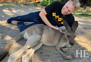 Carey Harrison pretending to wrestle with a friendly kangaroo on HE Travel's gay Australian Dreamtime tour