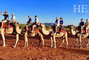 Group photo on camels during HE Travel's Gay Australian Dream time Tour