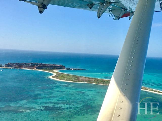 View of dry tortugas and beautiful turquoise waters from a sea plane window.