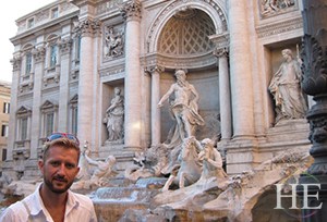 zach moses poses infront of statues in rome italy