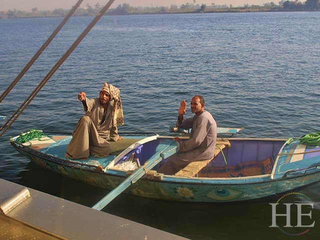 local fishermen pull up to the ss karim on the nile river