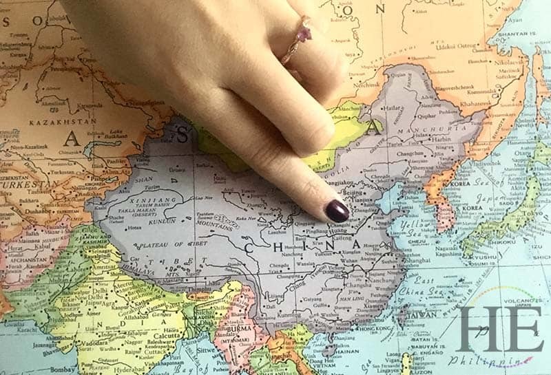 julianne points to luoyang china on a world map