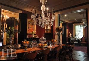 The formal dining room with a lavish chandelier and elegant deco at the Houmas House on the HE Travel New Orleans holiday