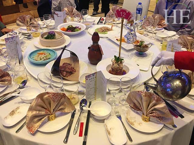 lazy susan table full of dishes at a water banquet in luoyang china