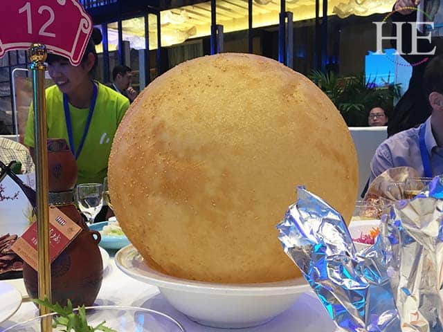 ginormous and delicious sesame ball at a water banquet in luoyang china