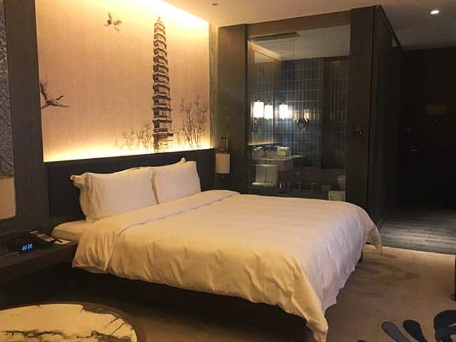 a cozy bedroom at the pullman hotel in kaifeng city china