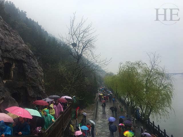 an array of colorful umbrellas on a gloomy day at longmen grottoes in luoyang china