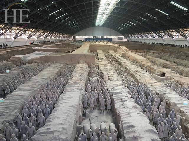 rows of restored soldiers at the terracotta army pits in xi'an china