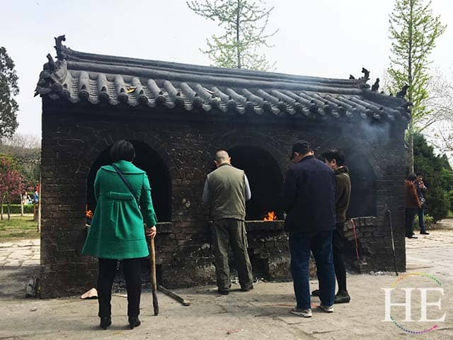 visitors burn fortune papers in a kiln at a park in zhengzhou