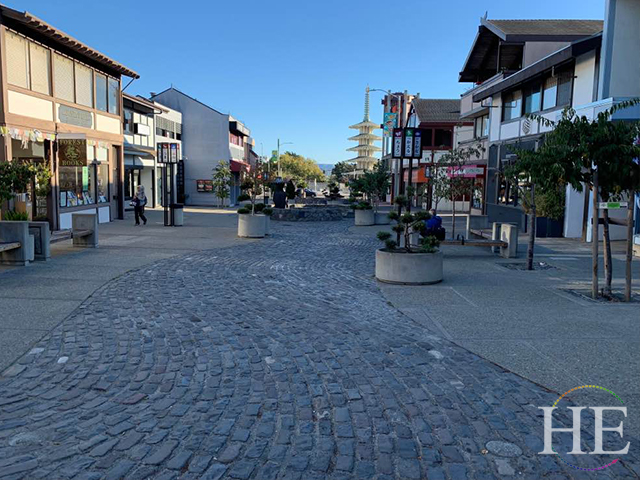 A cobblestone street and shops along Japantown in San Francisco.