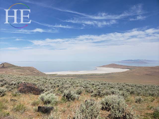 Bridger Bay Antelope Island Utah, beach scene with water and mountains in the distance