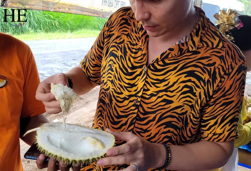 A guest determined to try the smelly fruit Durian