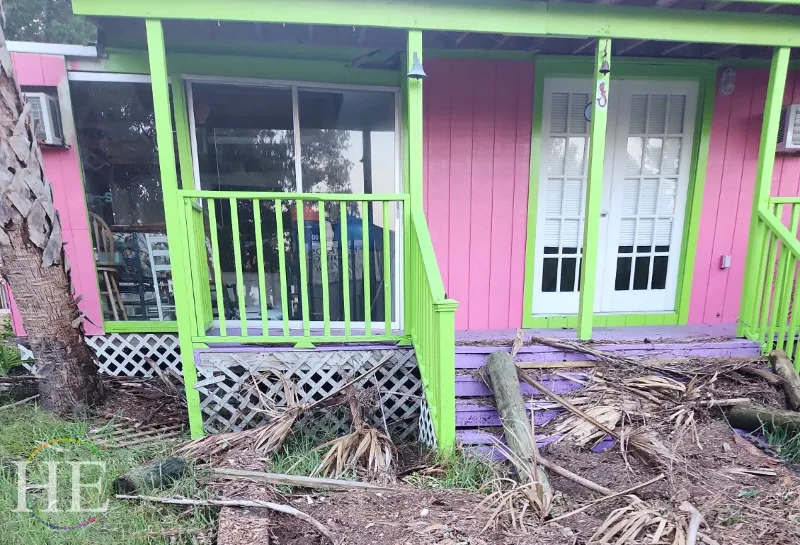 Debris on colorful porch showing hurricane debby damage